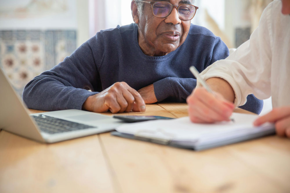 Person learning from notes being taken by person beside them